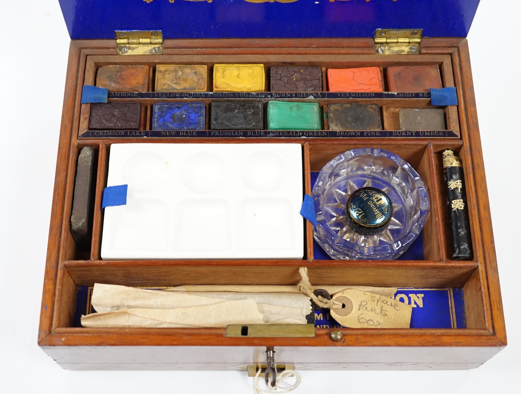 A Victorian Winsor and Newton artist's box with watercolour blocks, palettes etc. with key. Condition - fair